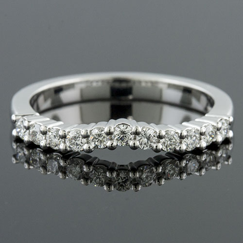 1389W-101P Mid Century-inspired common prong set diamond platinum curved shaped wedding eternity band