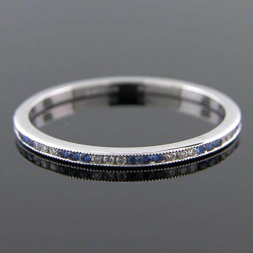 055-446P Ultra thin channel set alternating round sapphire and white diamond platinum wedding eternity band